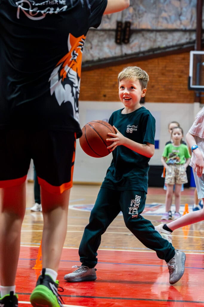 active home school children playing basketball during their day